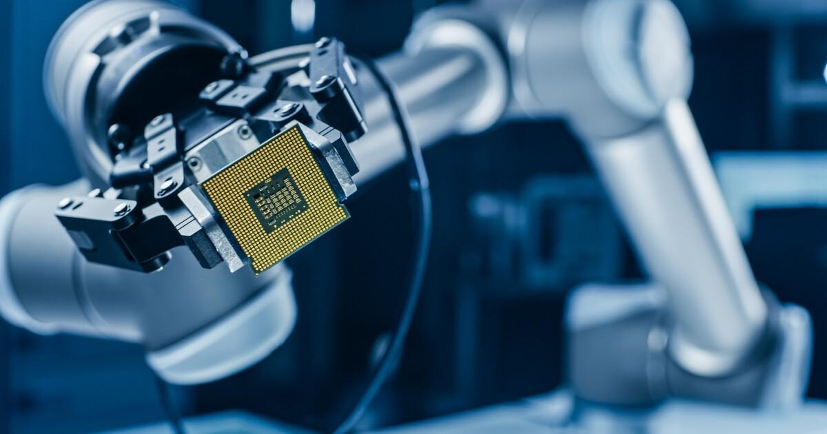 Robotic arm holding a computer processor
